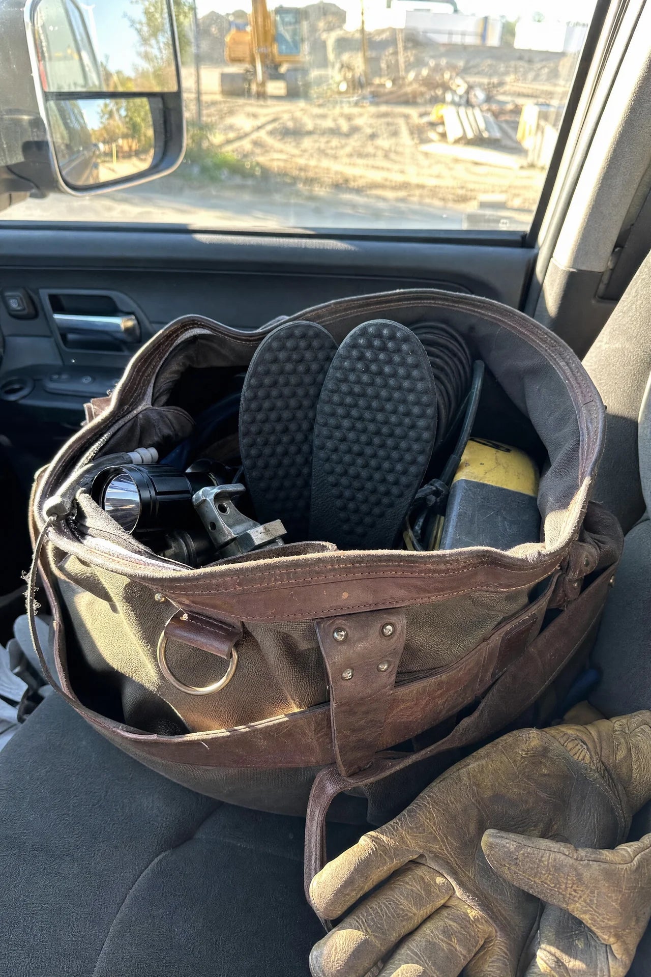Vealden insoles packed in a tradesman's work bag